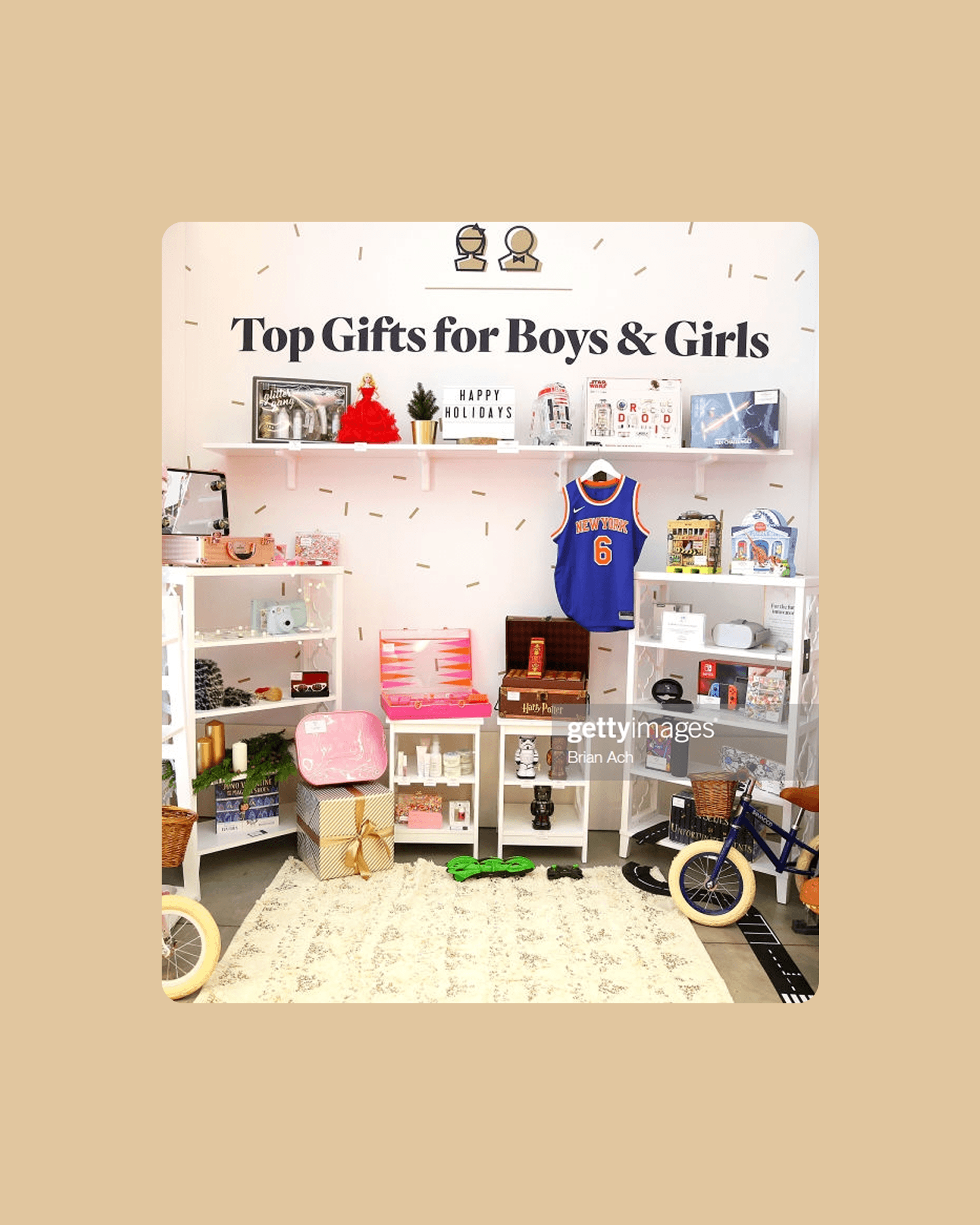 A curated vignette titled Top Gifts for Boys and Girls displays toys and apparel, one of twelve stations tied to text-to-order codes.