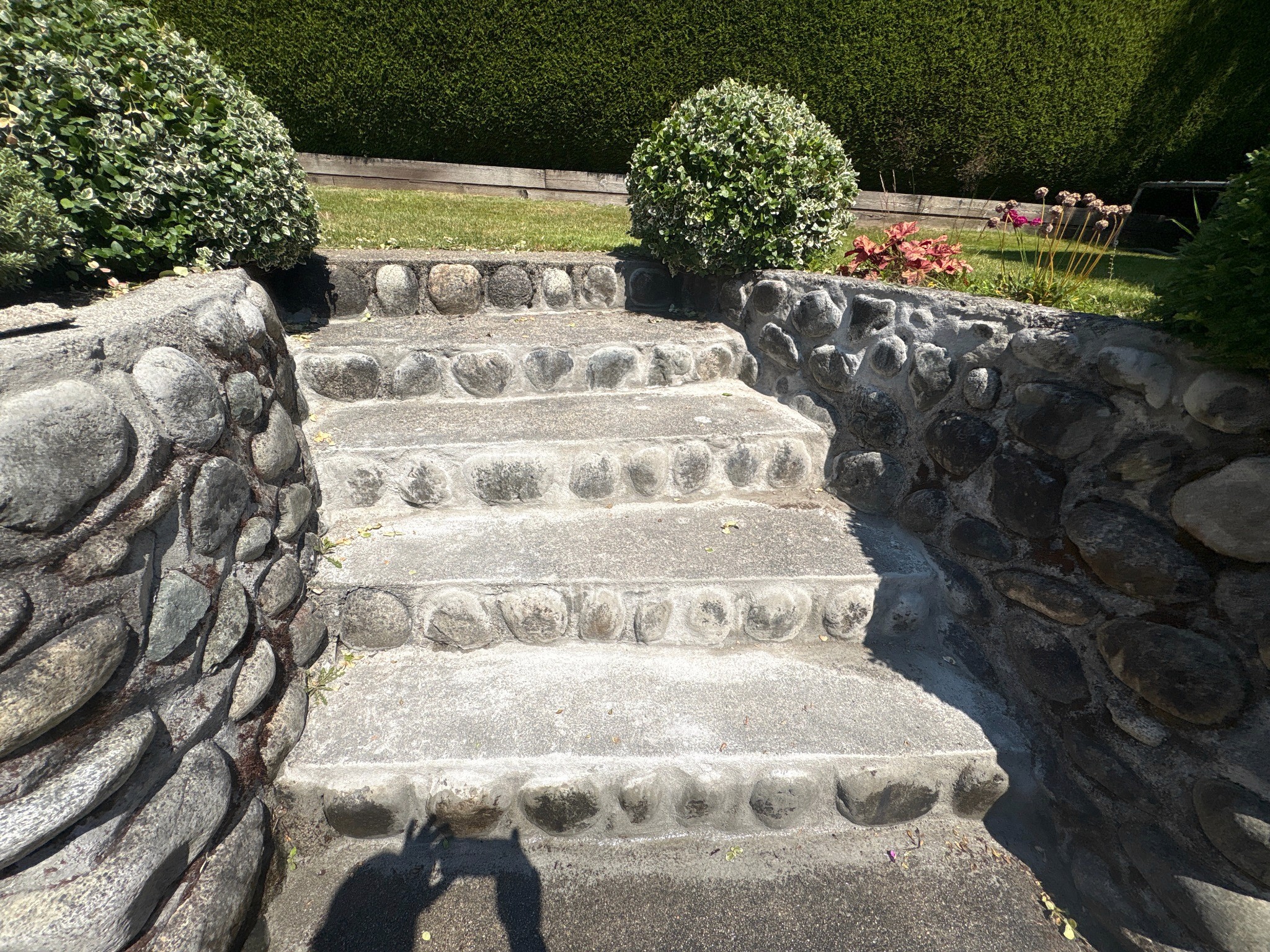 Stone stair masonry after localized repairs and restoration of deteriorated mortar joints.