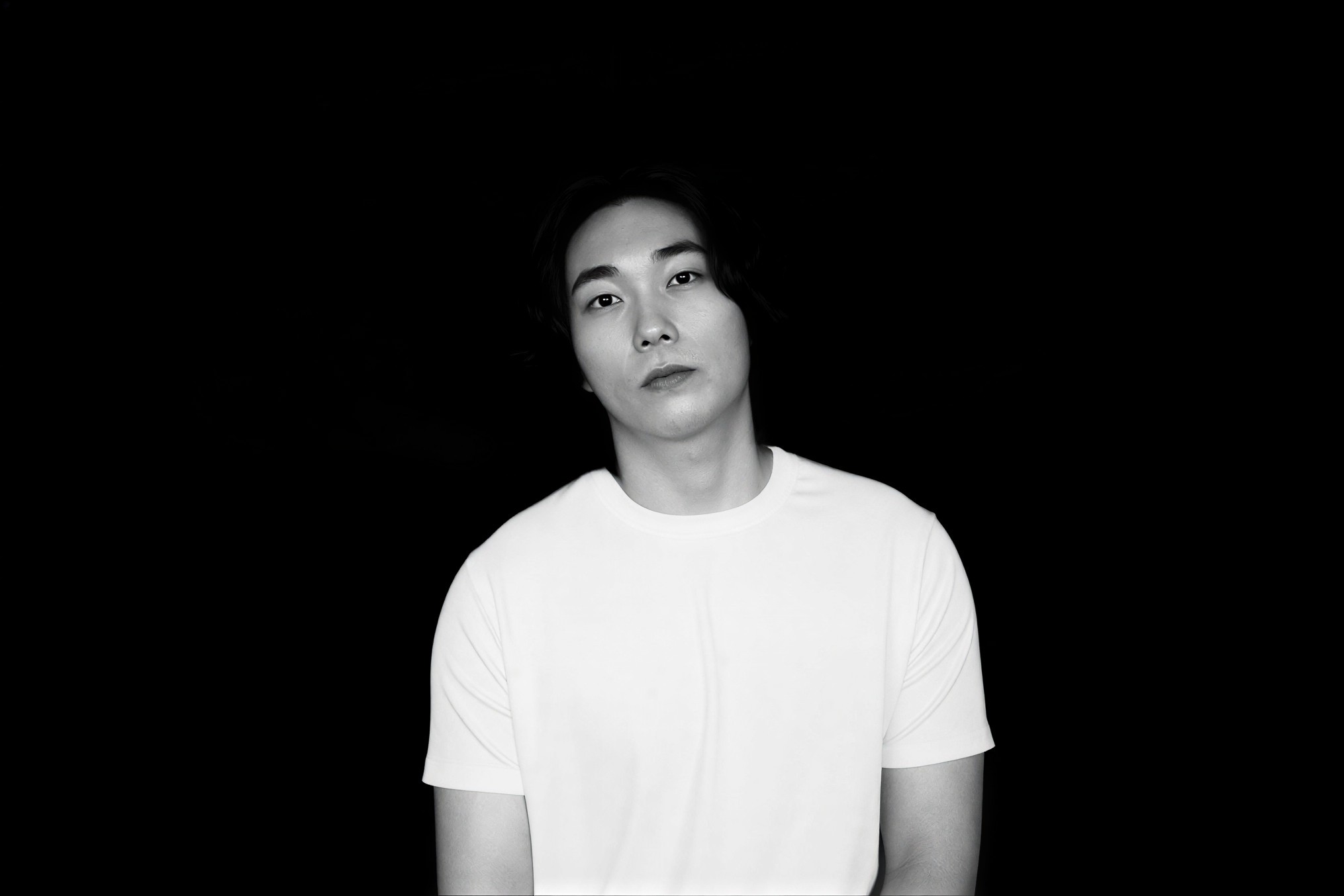 Tram driving on a snowy street at night