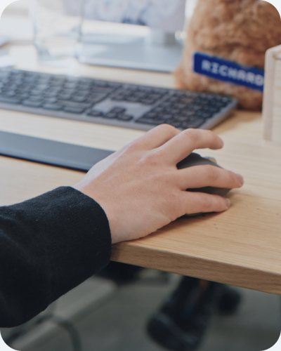 A hand on a computer mouse
