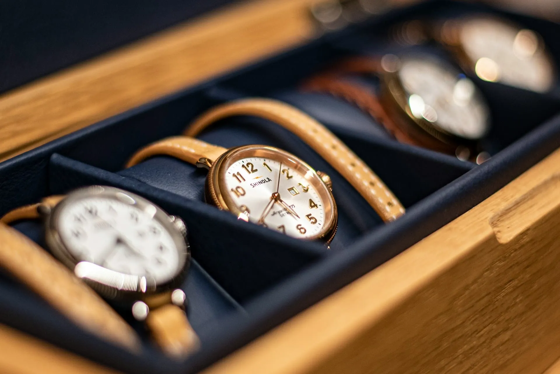 Watches in a wooden watch box.