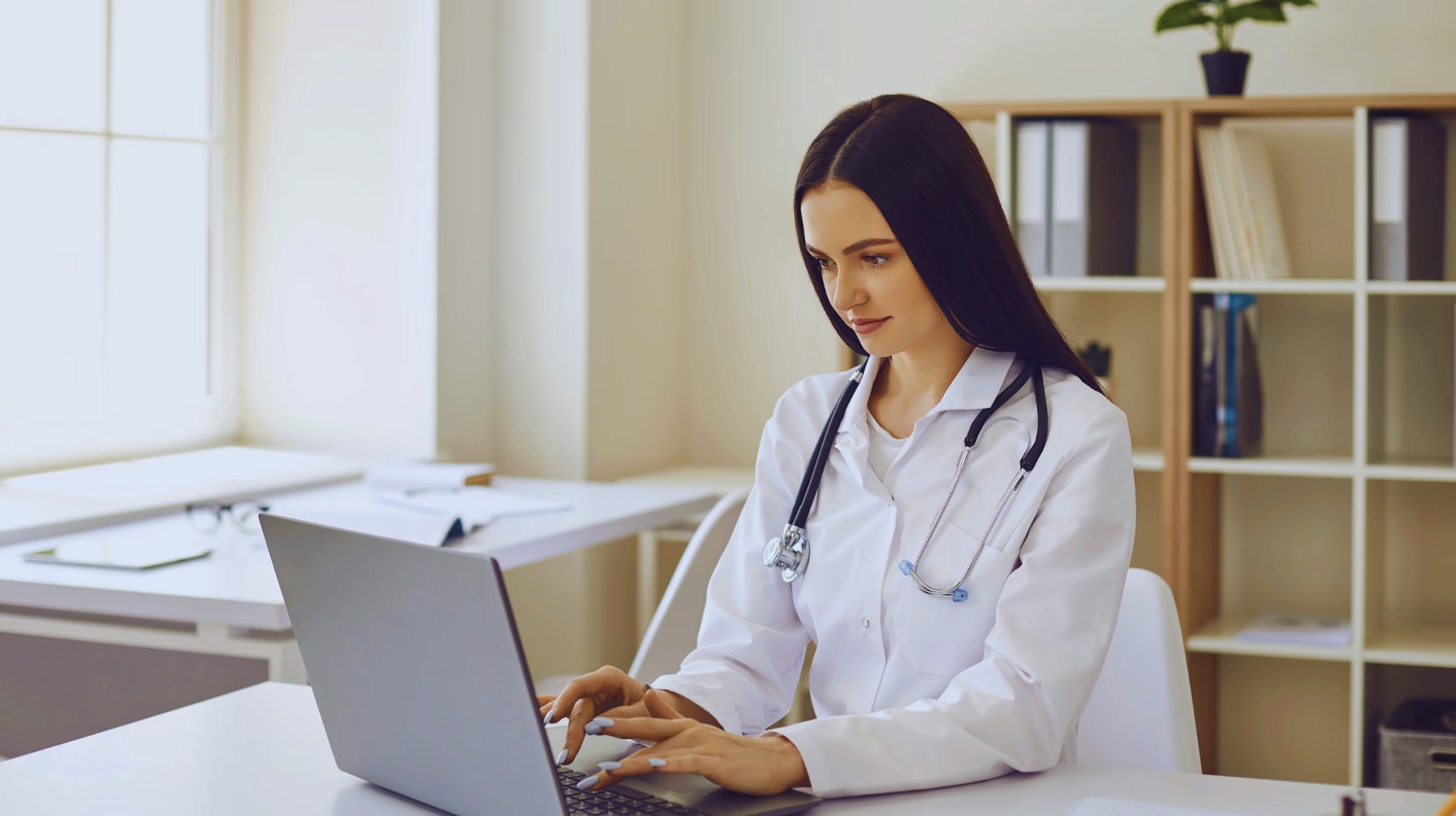 A laptop, tablet and mobile on a table