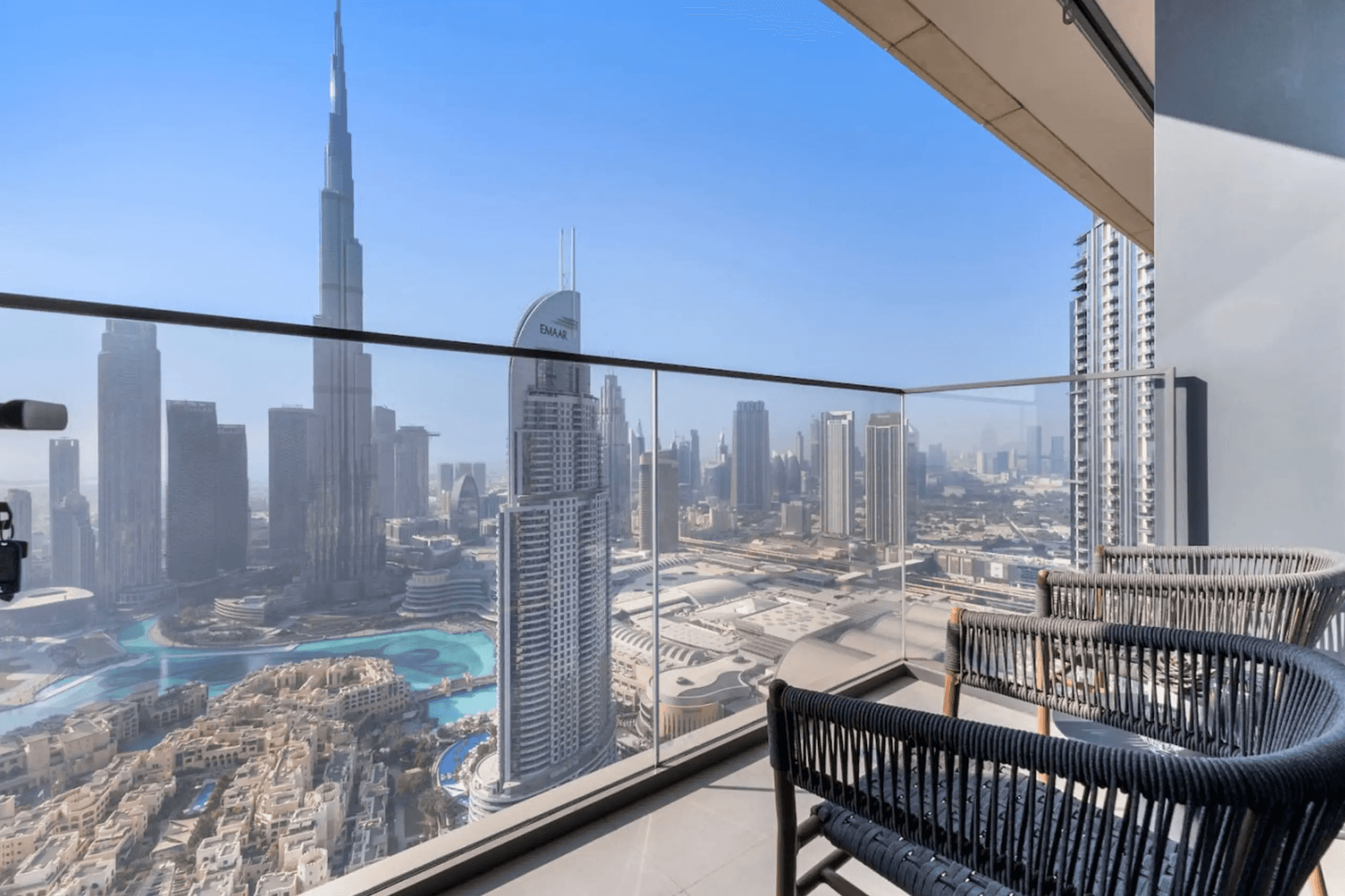 a living room filled with furniture and a mirror