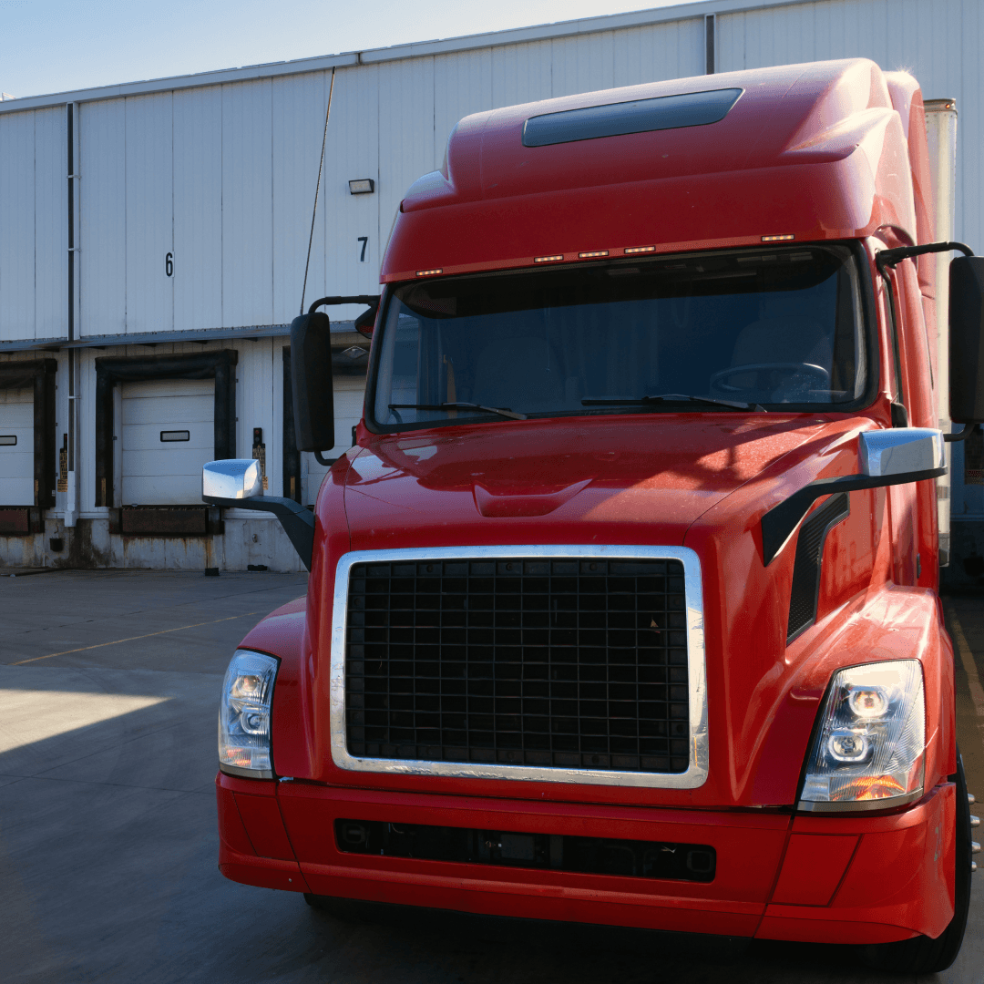 Semi-truck arriving at warehouse dock for digital driver check-in and appointment confirmation