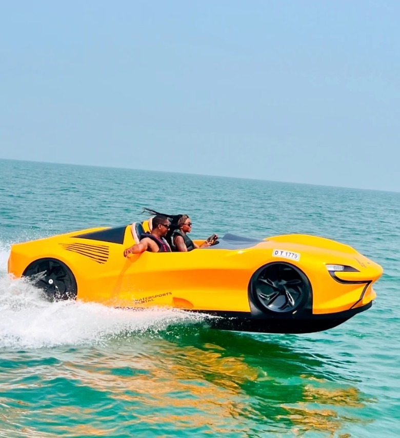 Woman driving a yellow jet car through the open waters. 