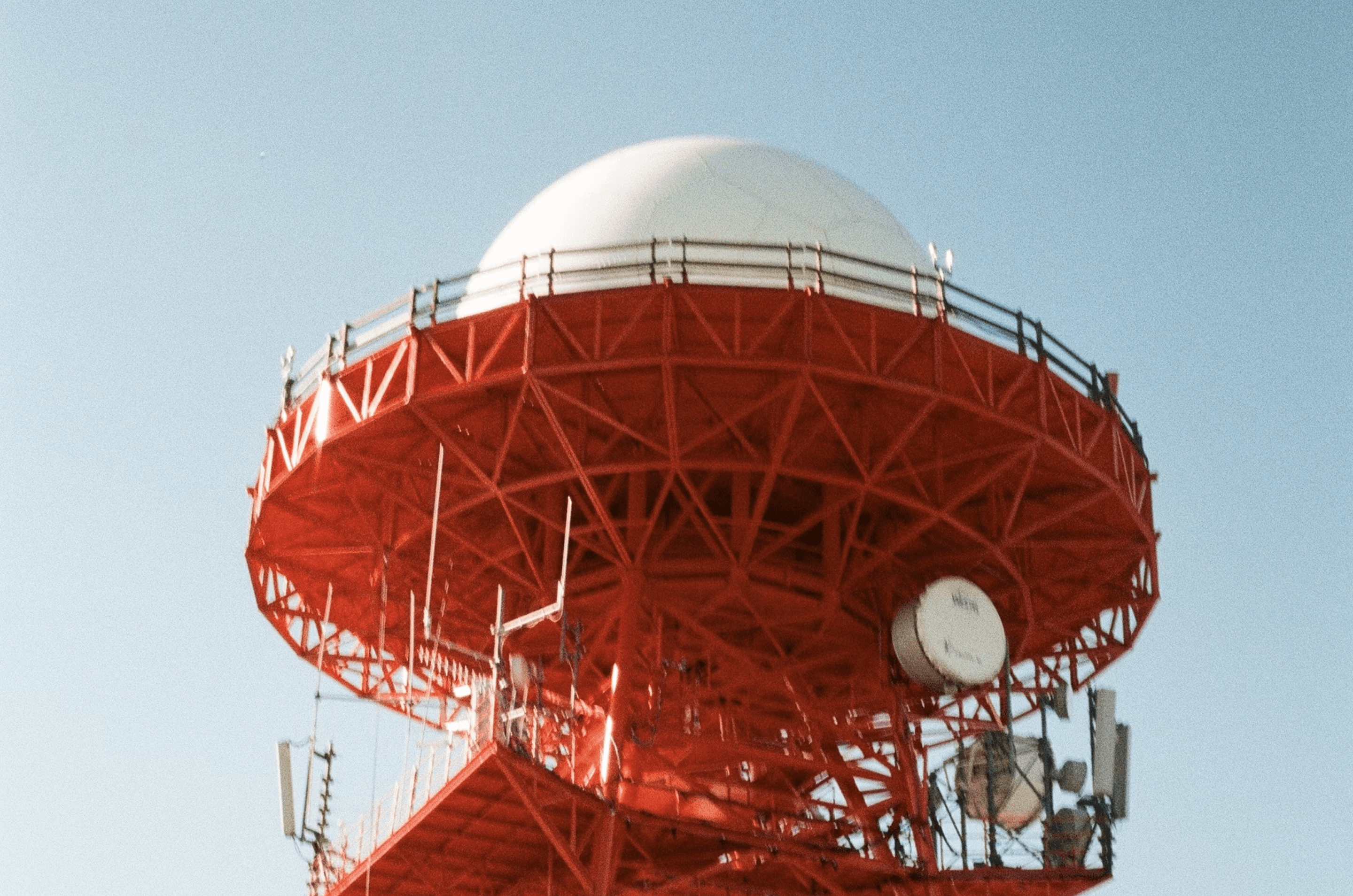 Red-framed observatory dome evoking B2B content marketing's broad demand generation impact in 2026.