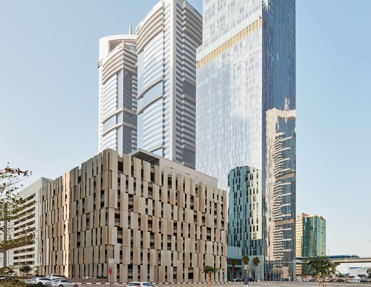 Exterior view of Rolex Tower showcasing premium real estate and modern architecture in a prime urban location.