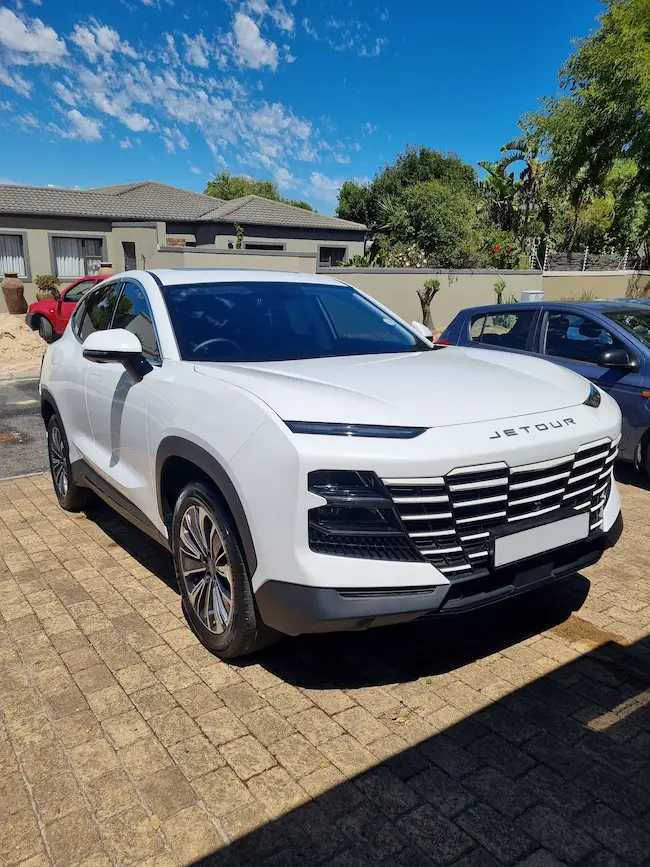 Front view of a clean white car. 