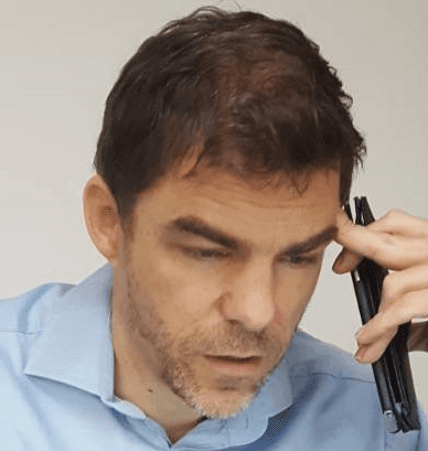 Man at work with phone in dand