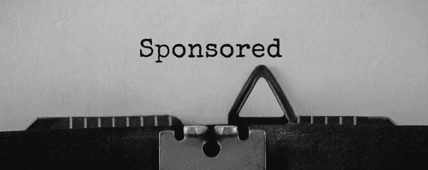 Stock image of typewriter with the word Sponsored typed