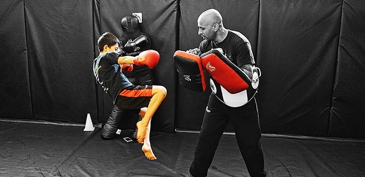 Children training Muay Thai in a kids class at Fearless MMA
