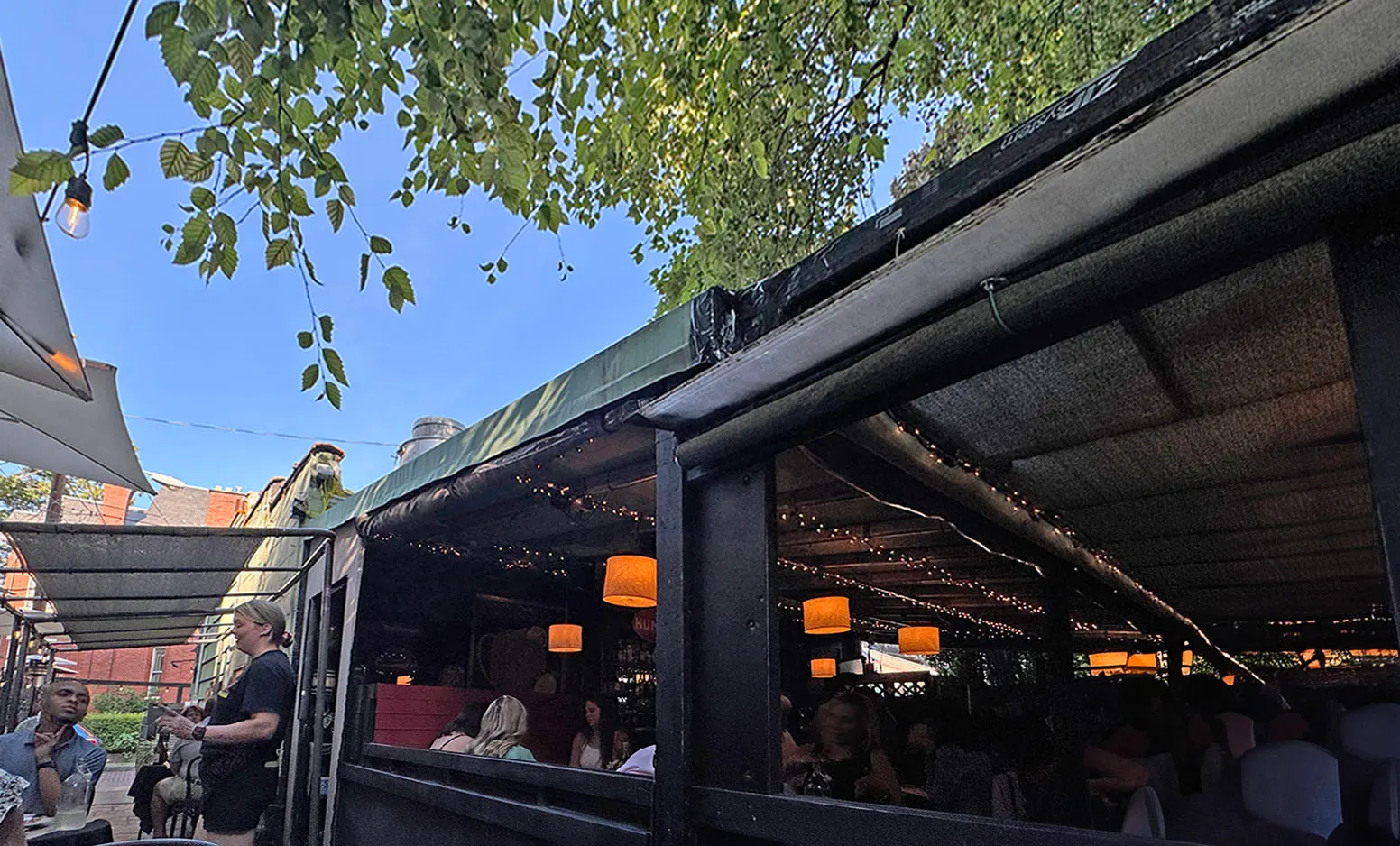Covered terrace under trees at Basi Italia