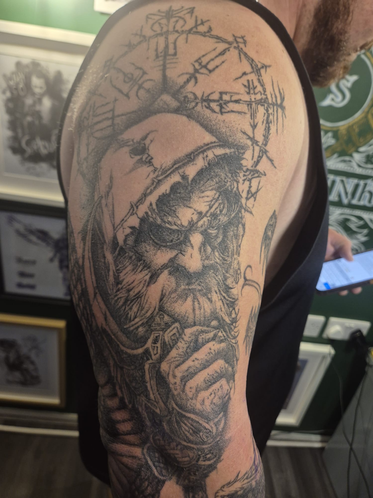 Black and grey tattoo sleeve with lion design in Hazel Grove