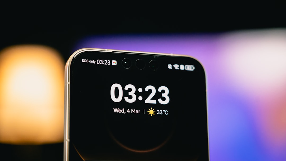 Close-up of a smartphone screen displaying time and time