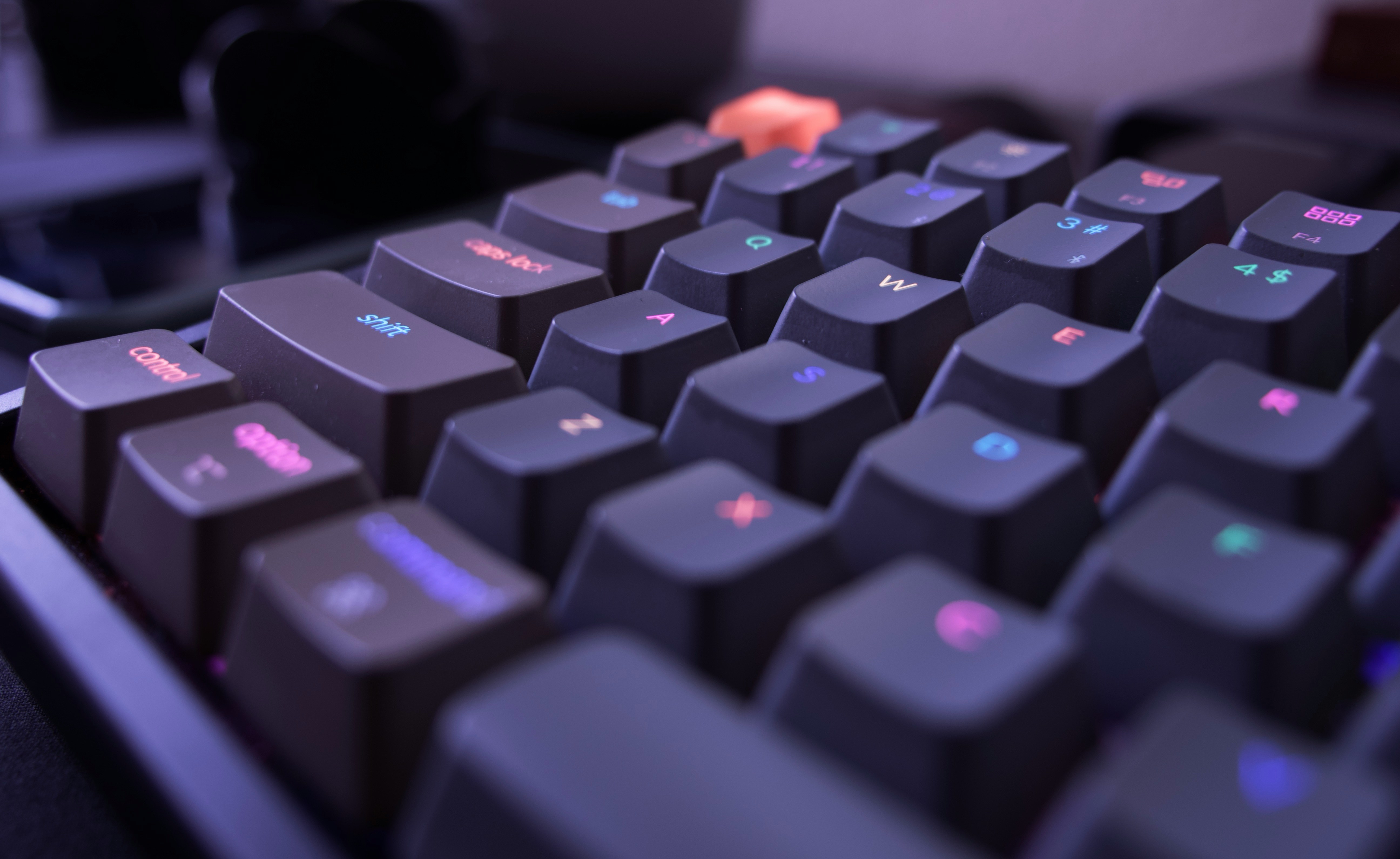 Close-up photo of a mechanical keyboard with colored key legends, representing shortcut keys and faster creative workflows.