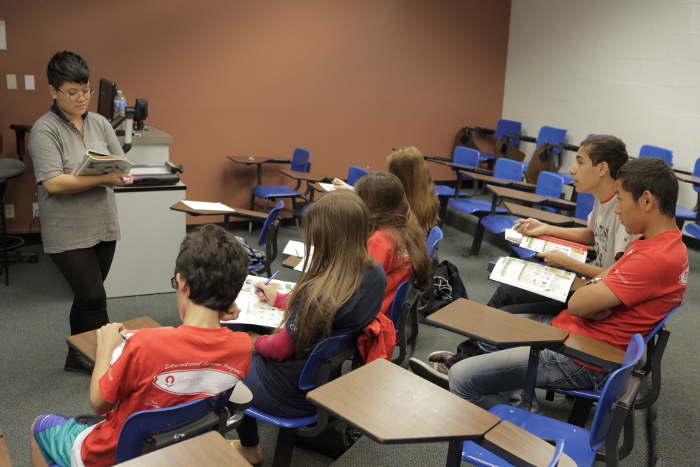 man in black suit holding woman in white dress walking on street during daytime