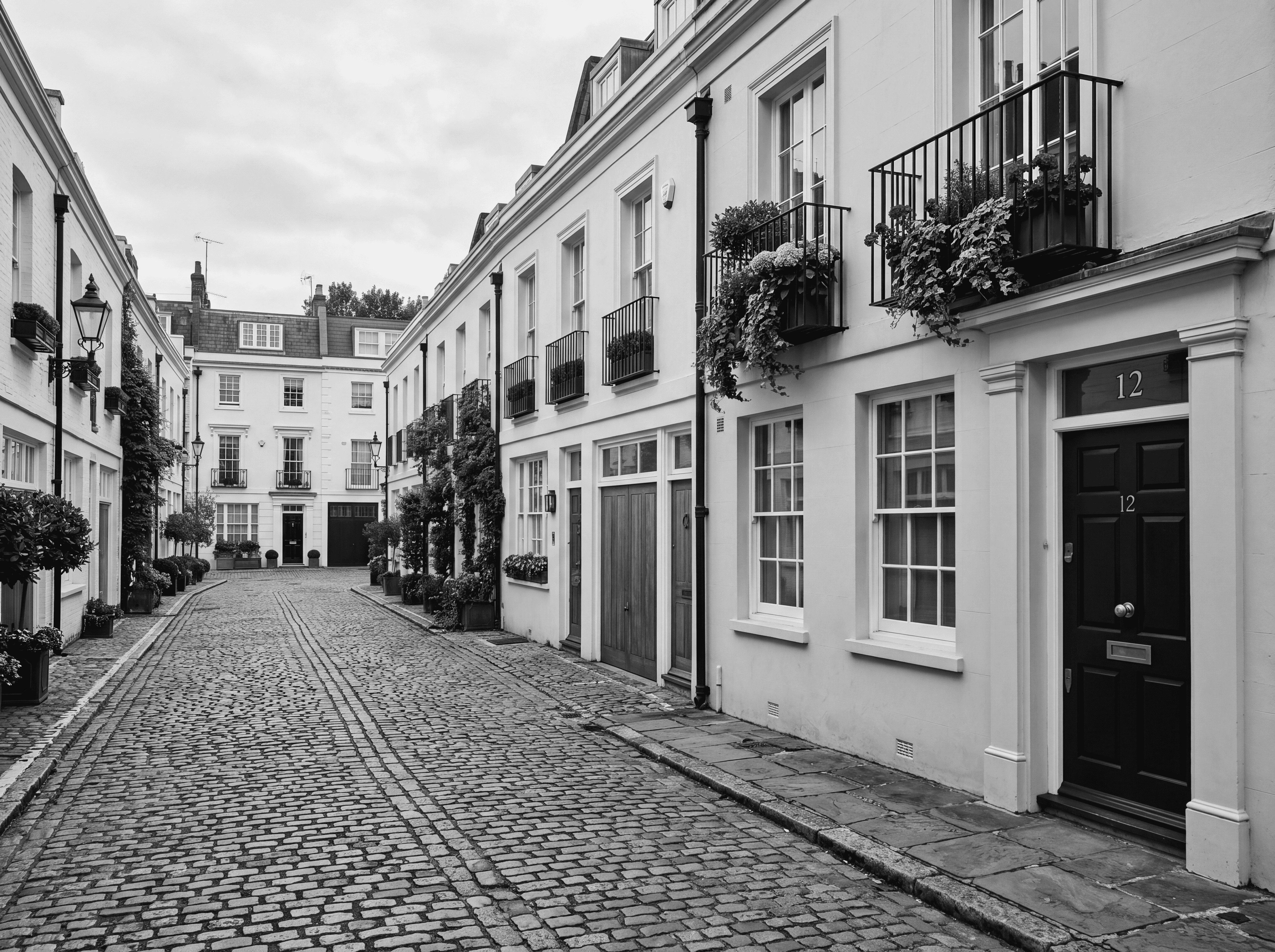 A Belgravia mews captured in black and white, representing retained tenant representation for Prime and Super-Prime London rentals.