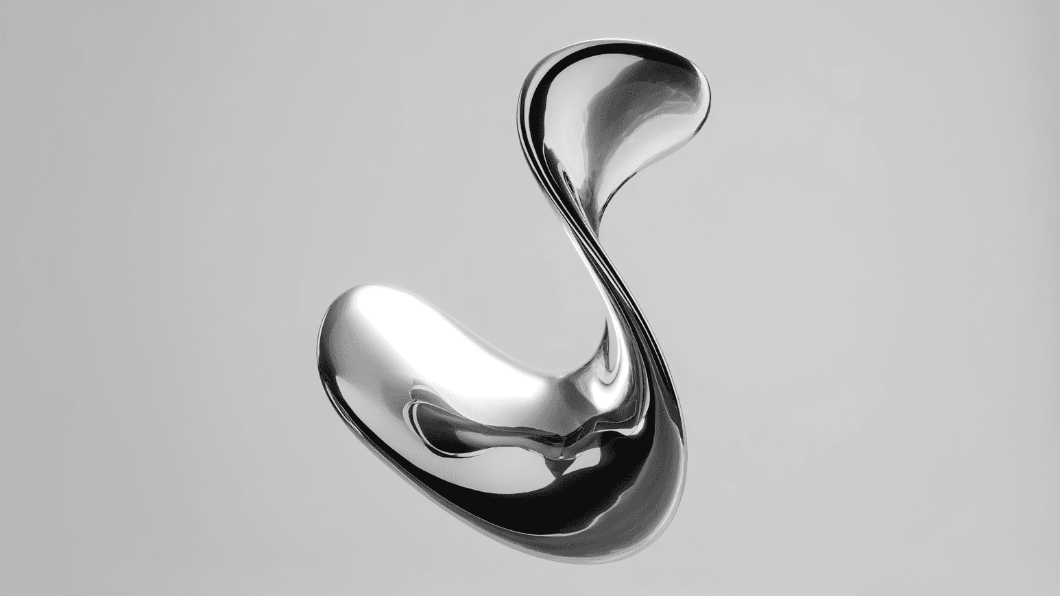 Laptop on a clean desk next to modern decor.