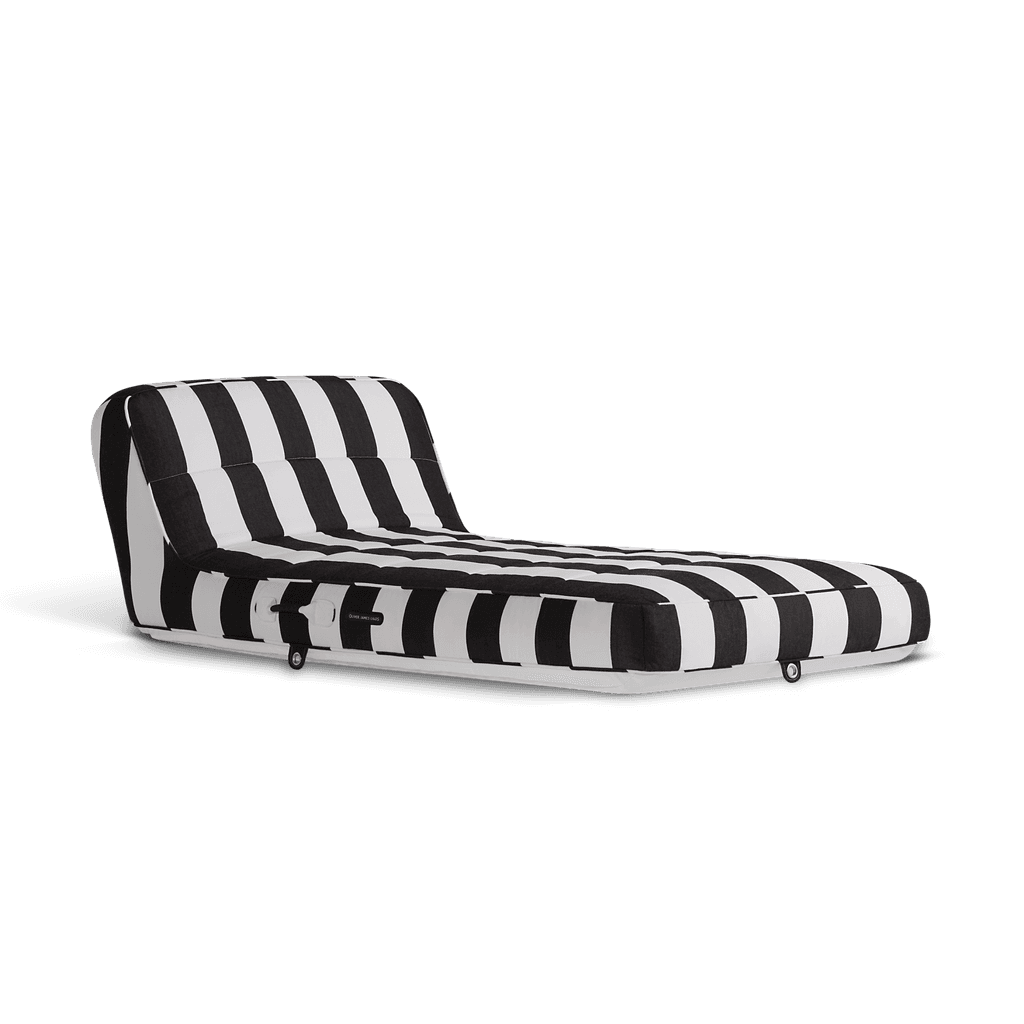 Luxury single pool float in black-and-white stripe canvas with progressive shading and matte white base