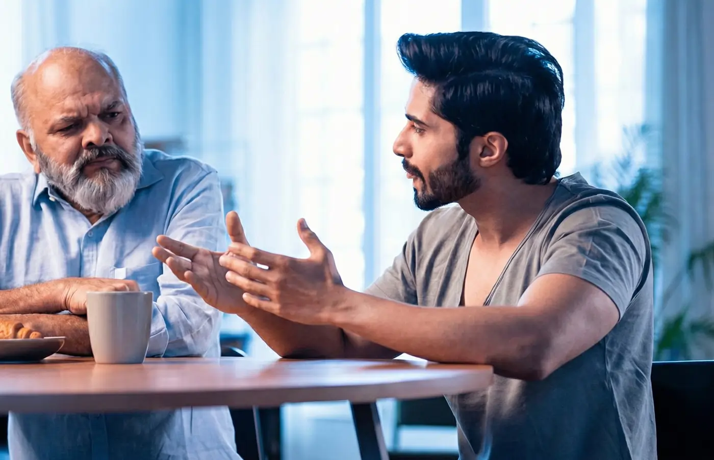 Family member discussing 24/7 caregiving needs with a loved one at home