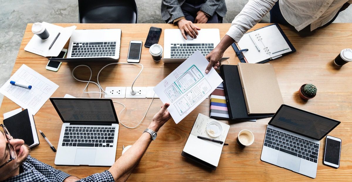 Have a meeting to discuss ideas on how to create your own social network.