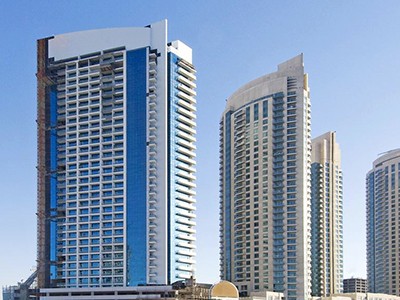 Wide view of Burj Al Nujoom and surrounding towers. Specialized real estate support for Downtown Dubai living.