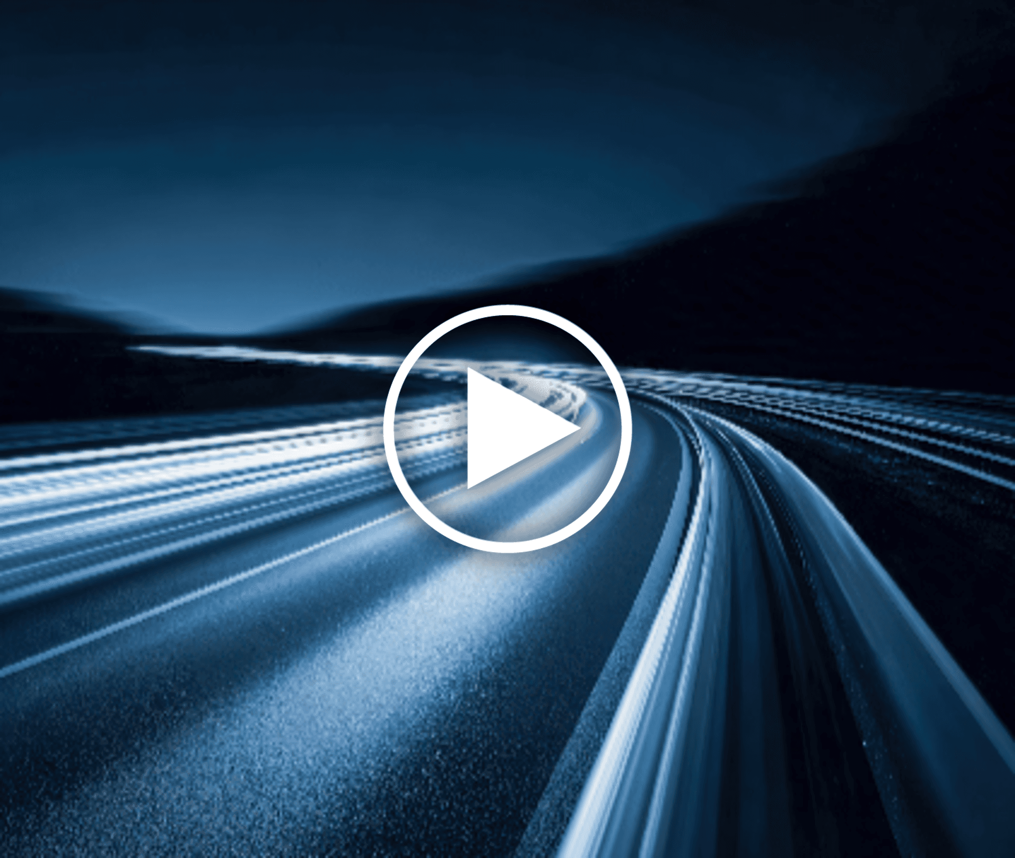 Wind turbine overlooking bright green farmland and scattered buildings