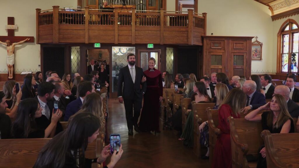 Groom walking down aisle at St. Mary's Catholic Church Aspen wedding ceremony