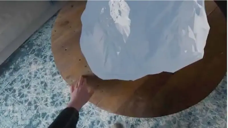 Headset view of a hand on the table beside the mountain