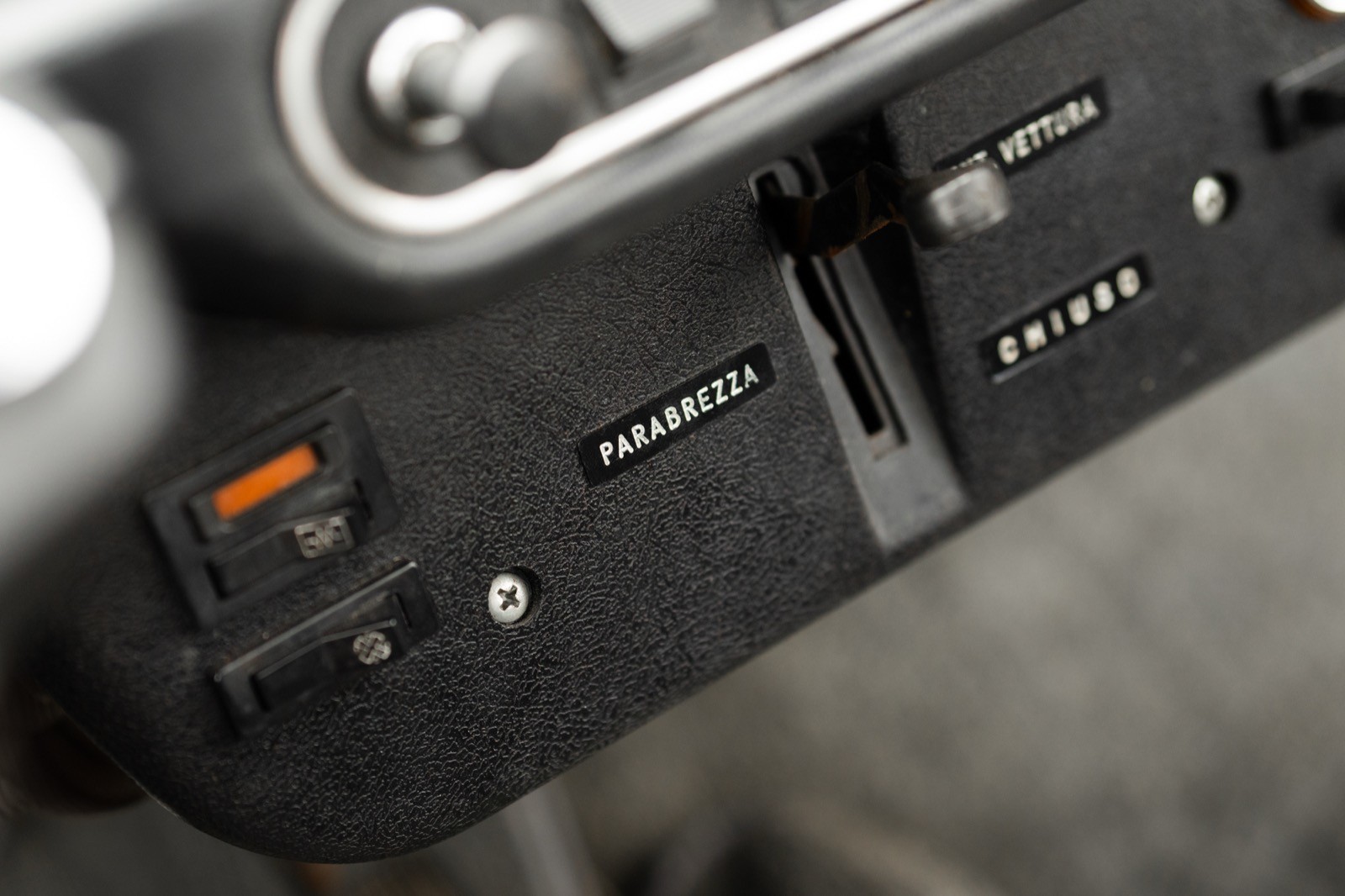 Close-up of a control panel with switches and buttons, likely from a vehicle or electronic device.