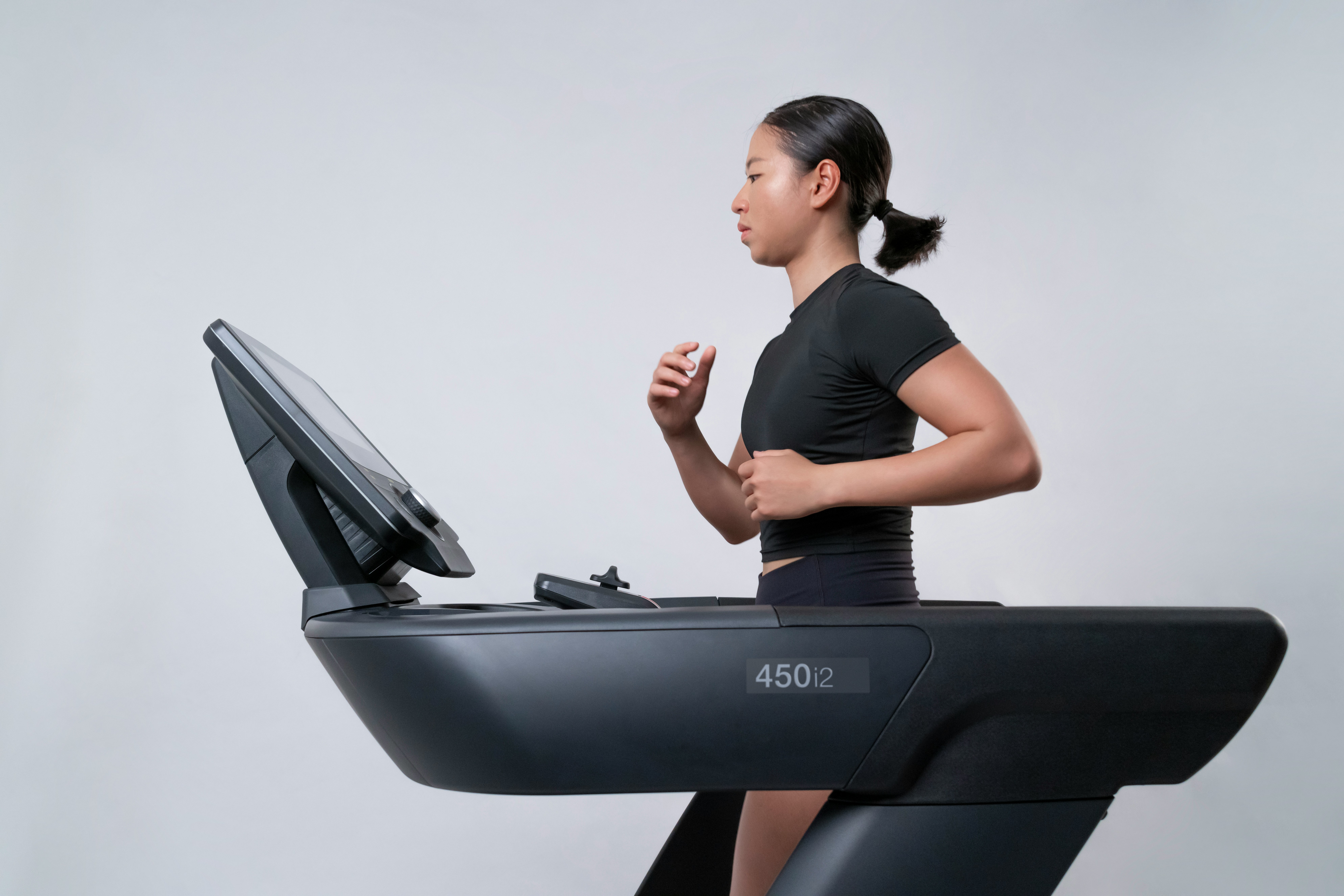 a woman running on the treadmill