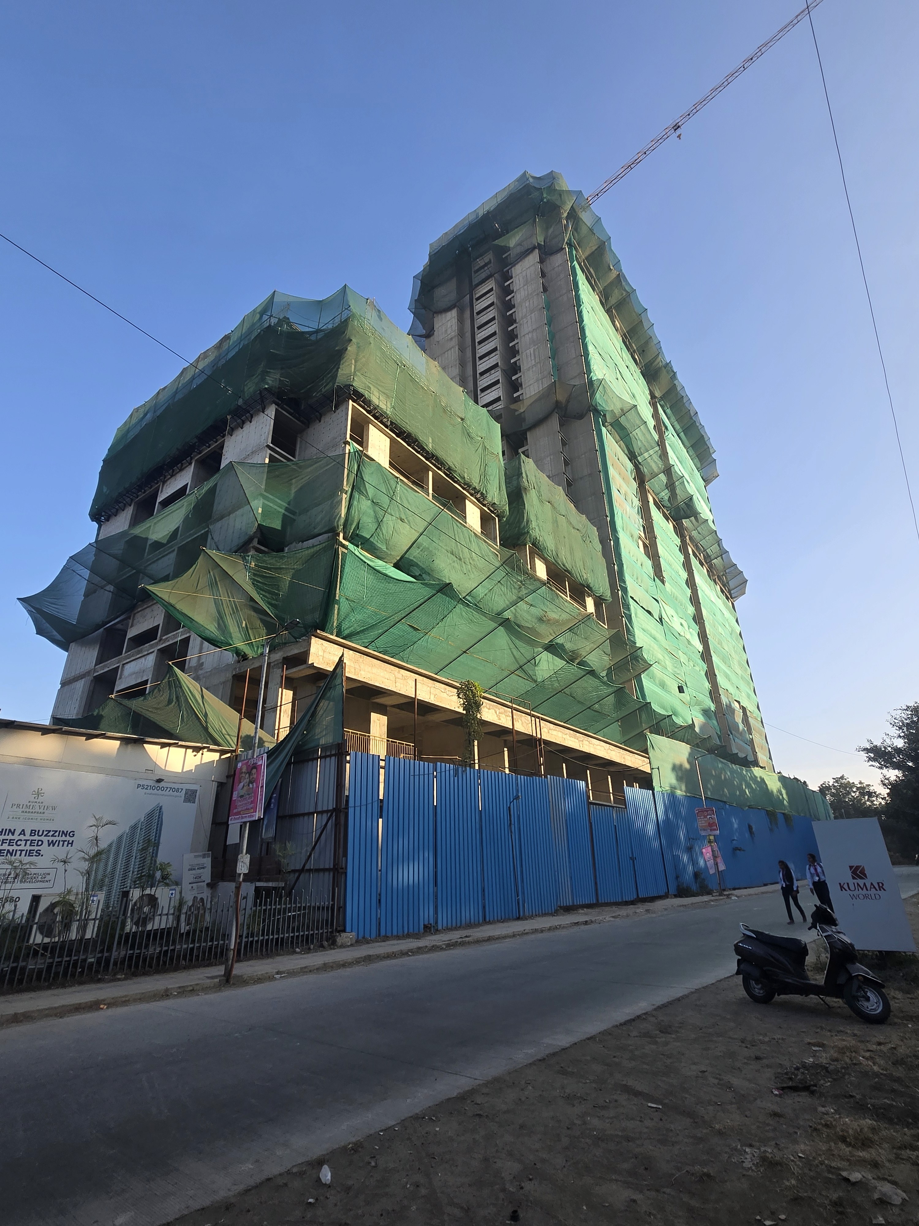 Safety net installation at high-rise construction site of kumar world