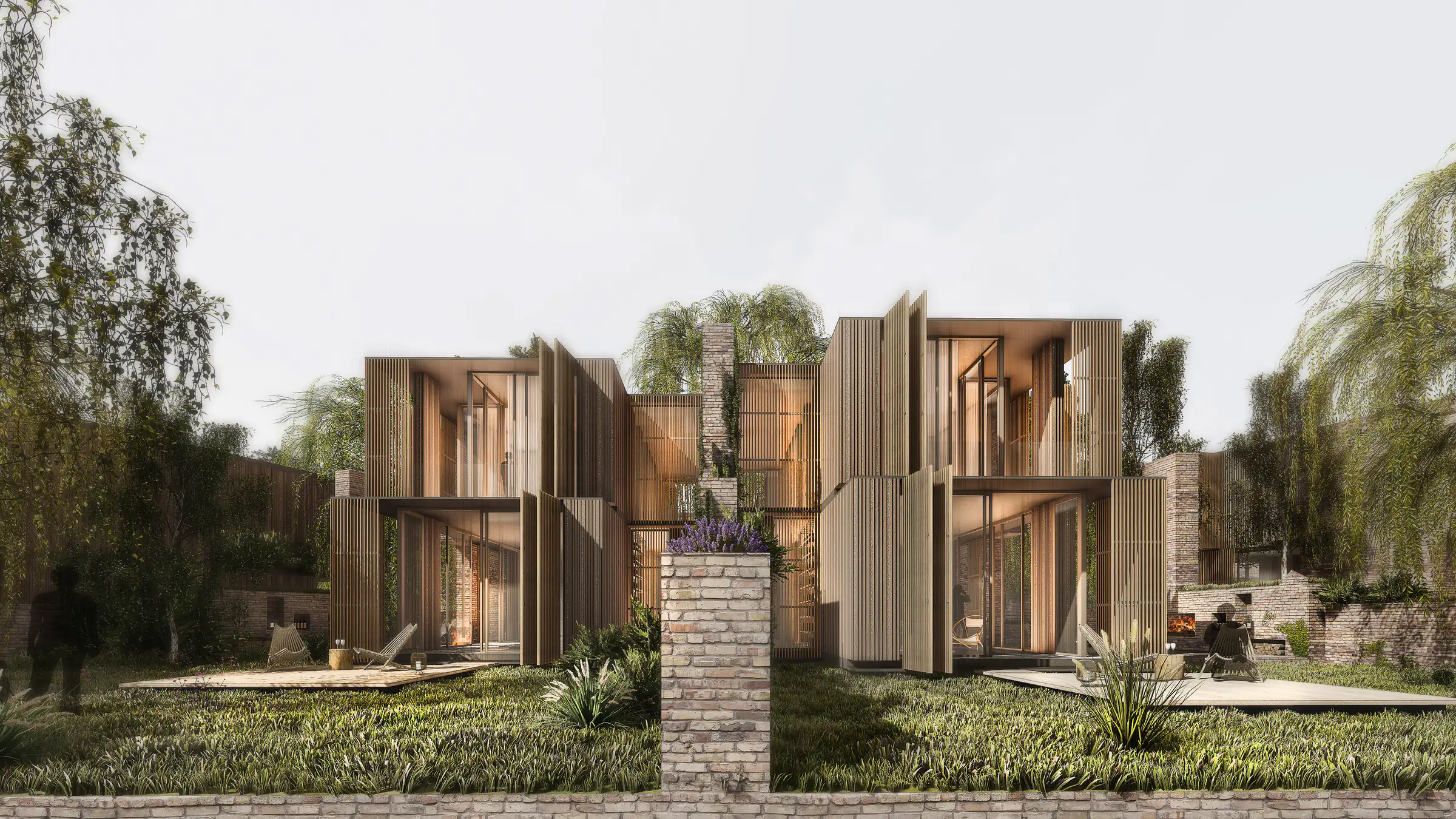 View from the garden to the timber-shuttered façades of the villas