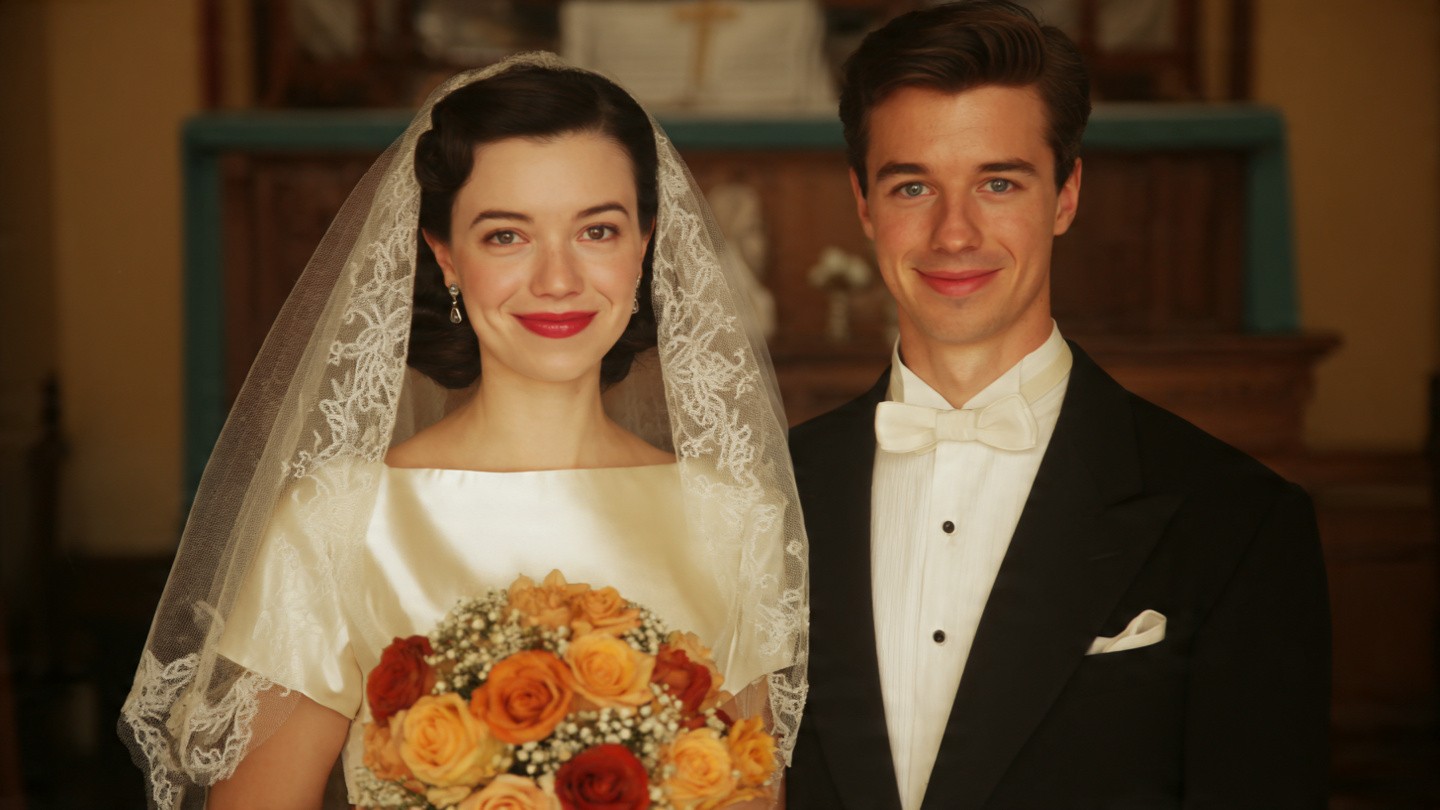 A white and grey high-top sneaker paired with a black version.