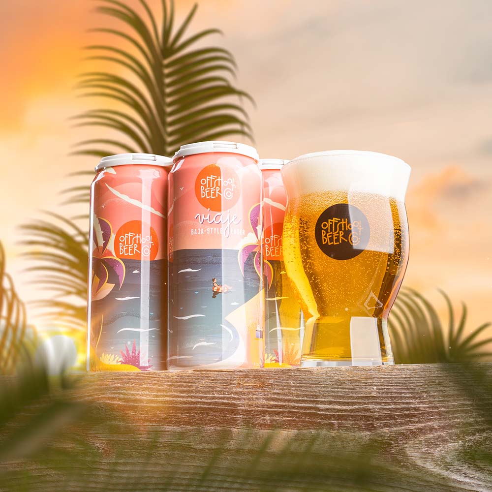 Sunset beer can lineup with glasses in warm lighting