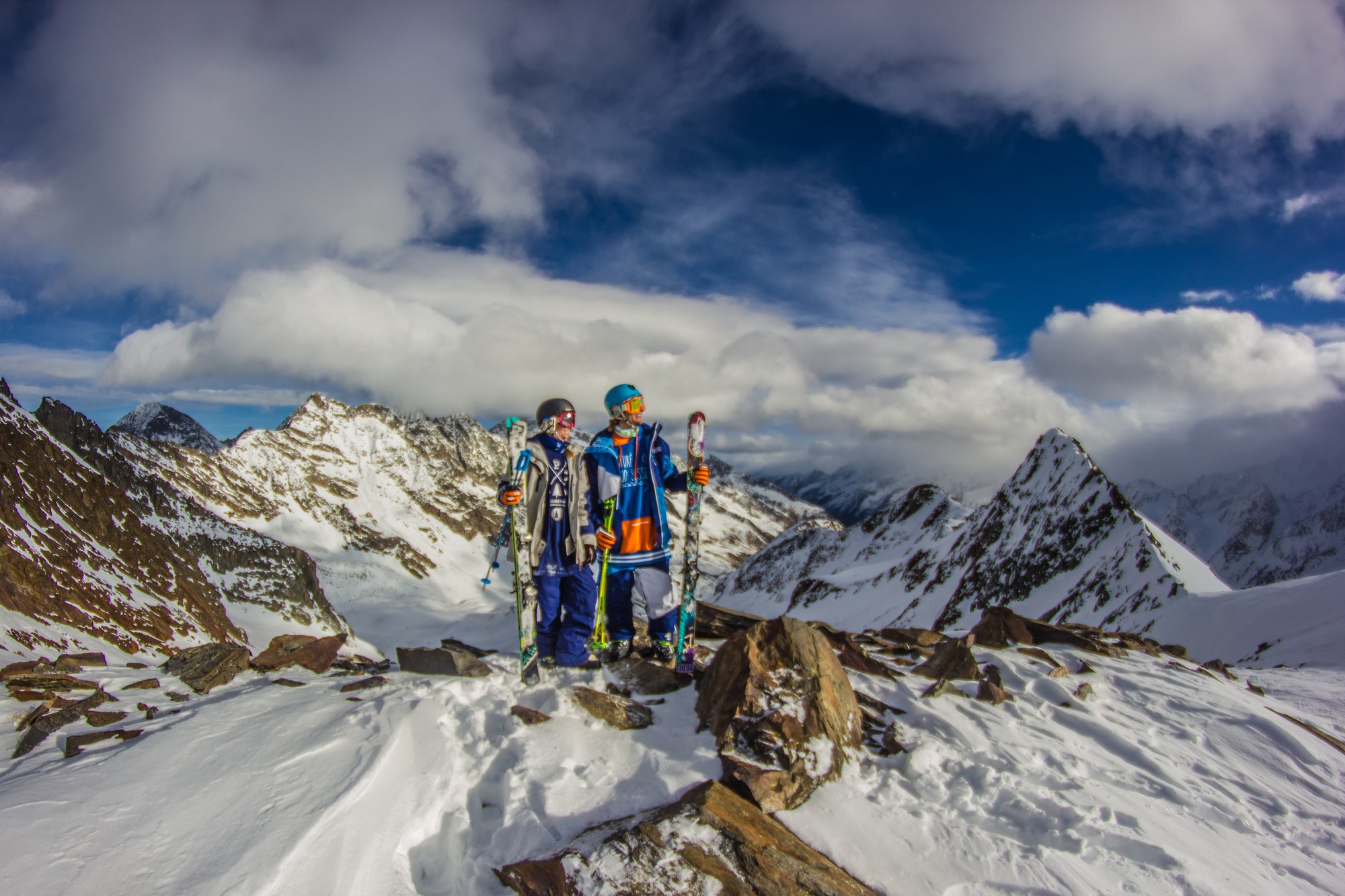 Two skiers on a glacier ridge with a wide panorama behind them — the Stubai valley episode after the New Zealand shoot