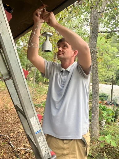 JT installing a camera system for a home in birmingham.