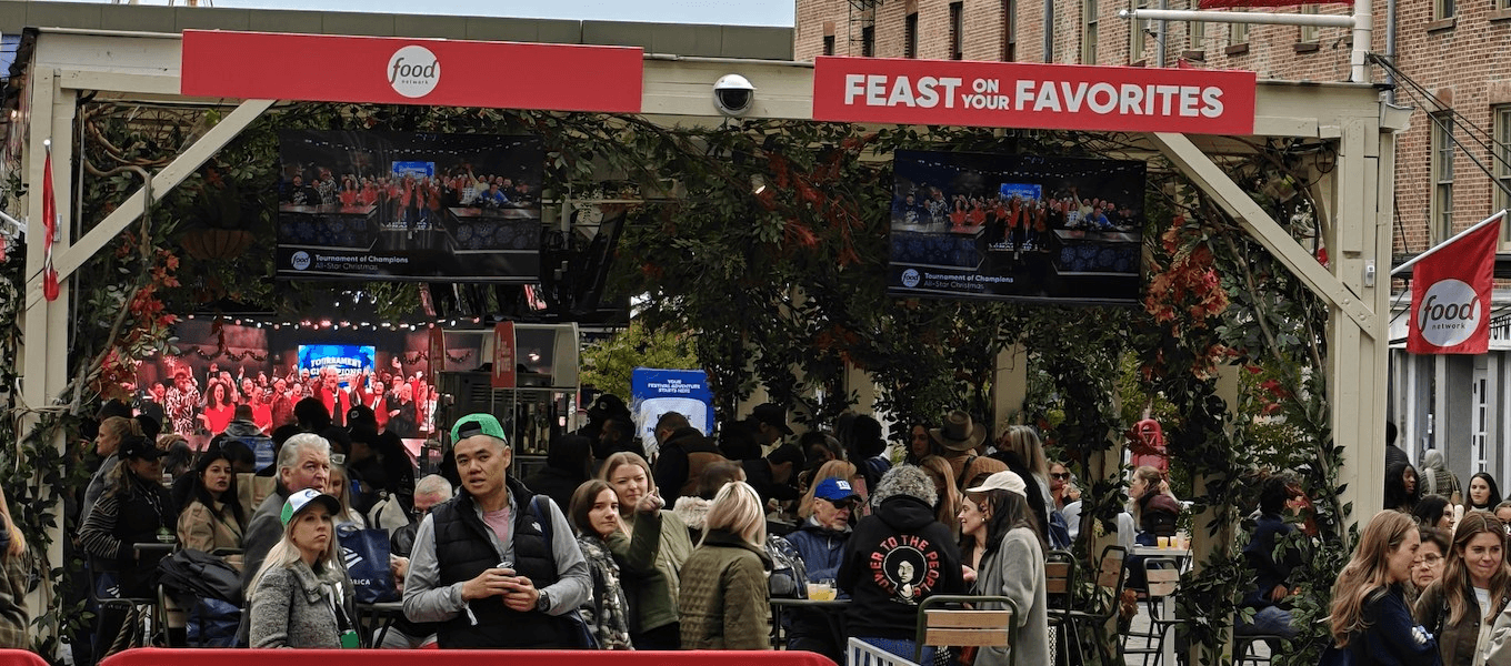 Festival guests under the Feast on Your Favorites arbor at the South Street Seaport