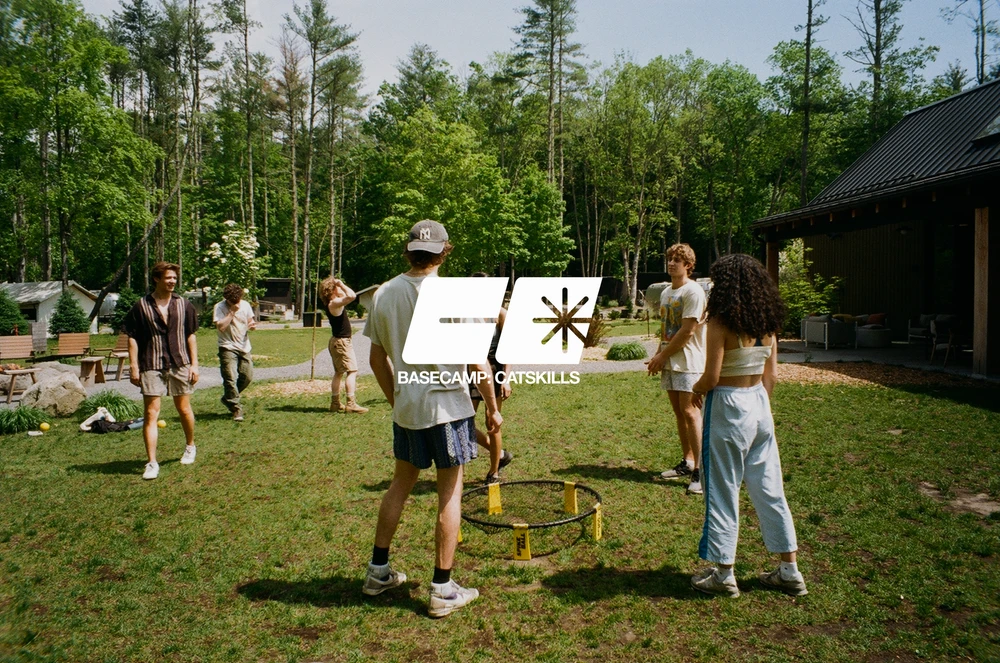 The image features an intricate network of white, web-like structures set against a deep blue background.