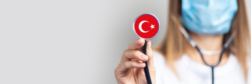 female doctor with stethoscope with turkish flag