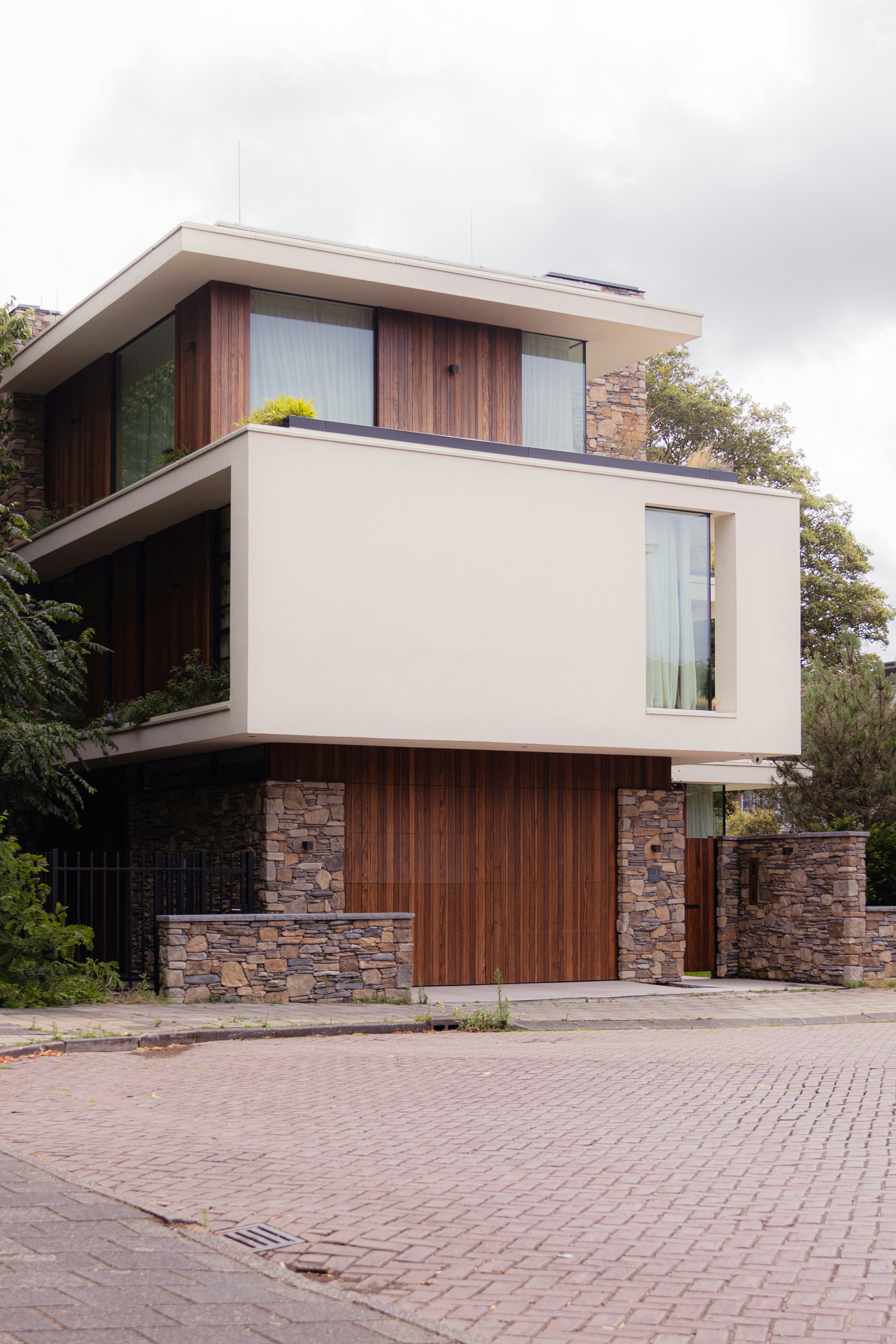 a large white building with wooden doors and windows