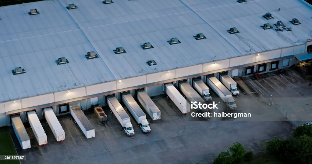 lurred crowd of people walking through a busy airport or transit terminal.