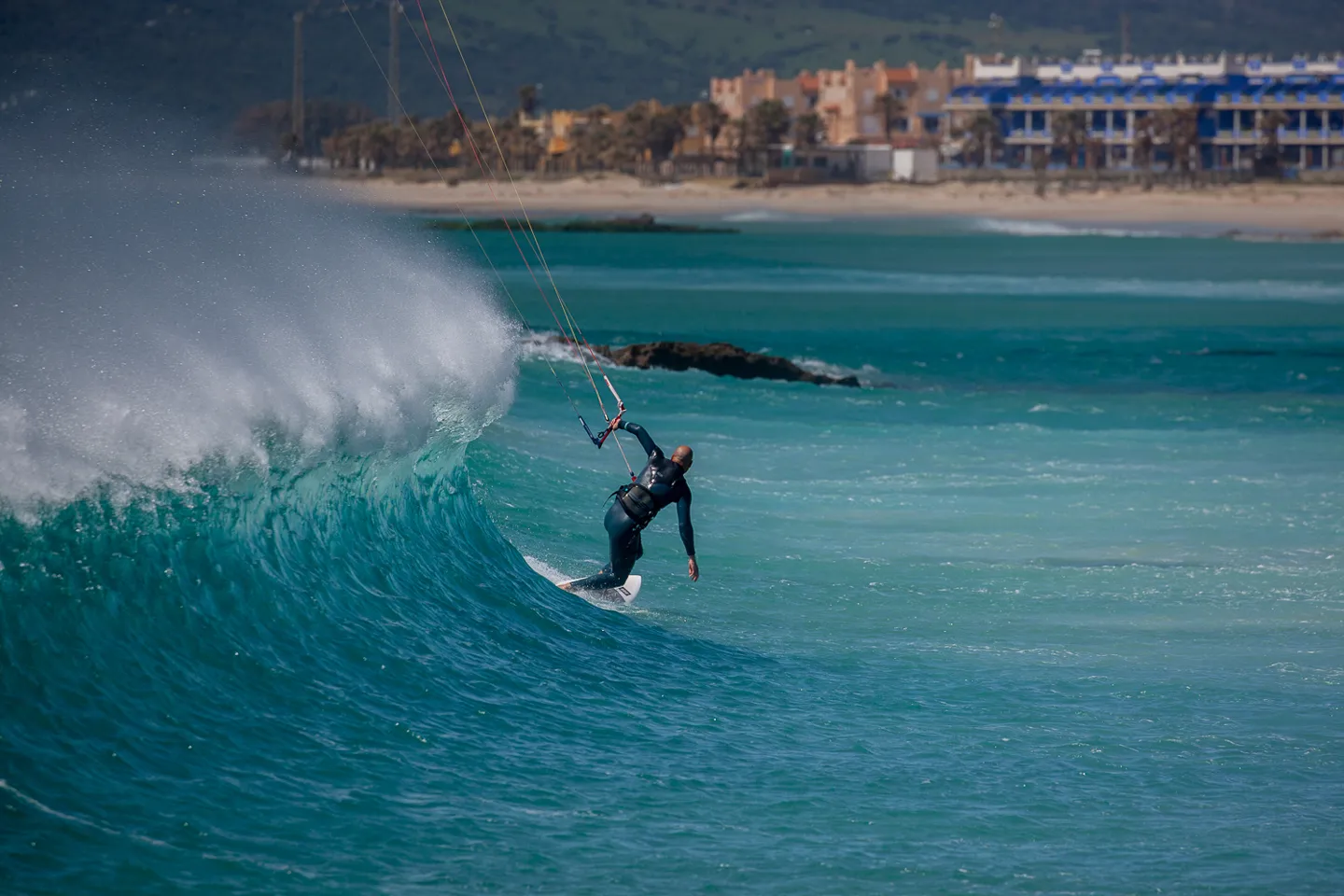 Founder Gabri kitesurfing at Balneario, the legendary kite spot of the Strait of Gibraltar — Explora Watersports Tarifa
