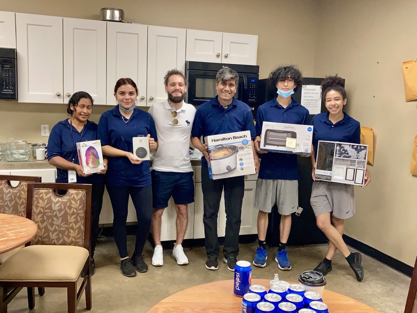 ATI crew celebrating together in a break room