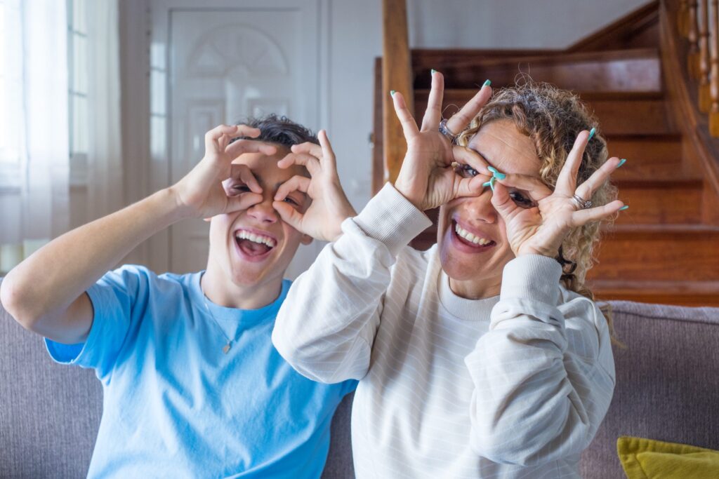 a group of children sitting on steps in front of a building