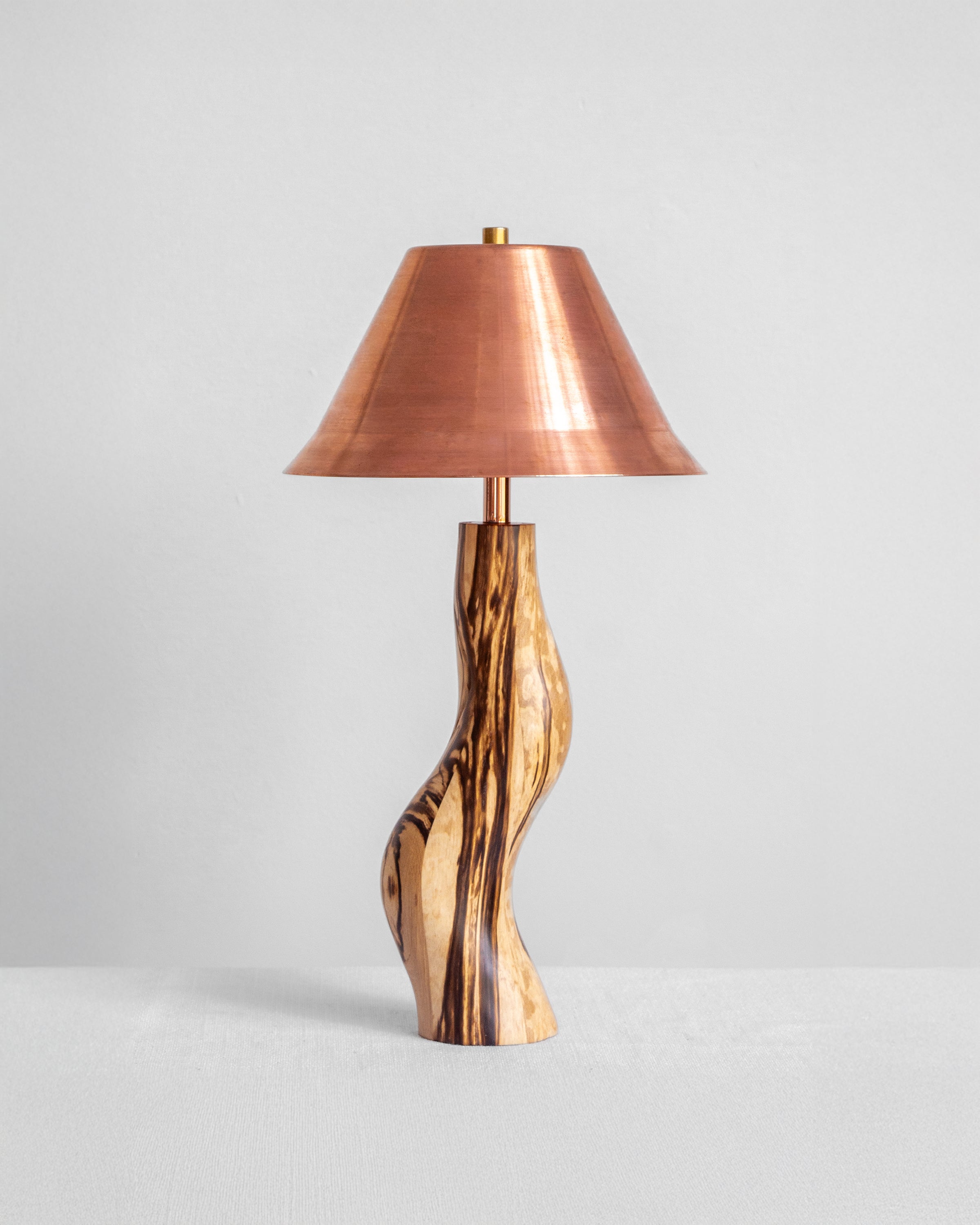Dancing Desk Lamp with Spalted timber base and Copper shade on a light grey background with UK, EU and US/CA wiring available Wilkinson & Rivera