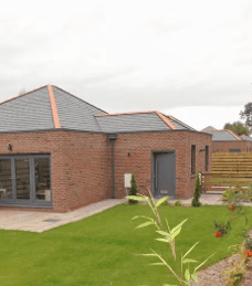 one brick bungalow with a large garden