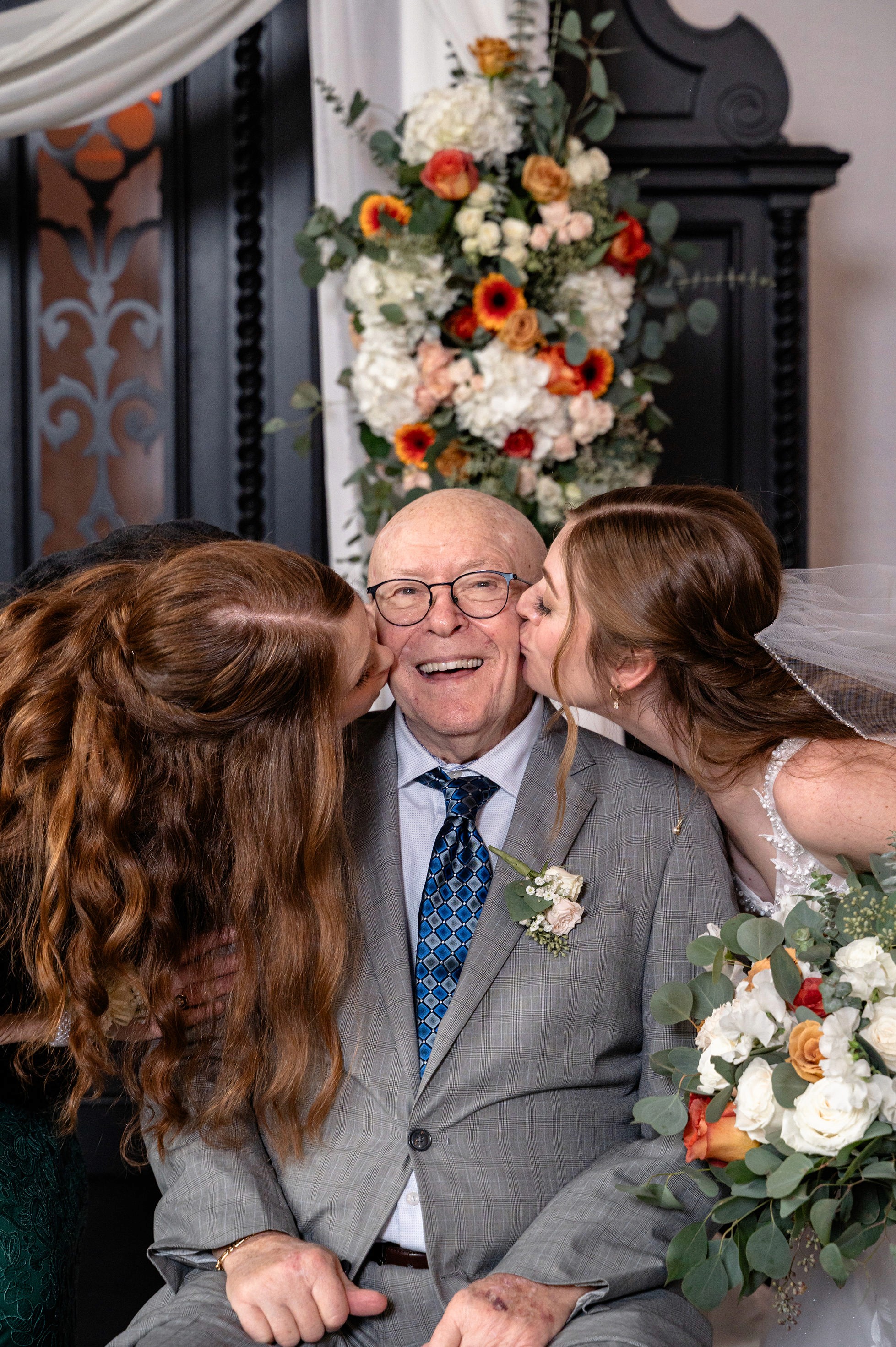 Flat lay wedding details with bouquet, rings, and sparkling bridal heels