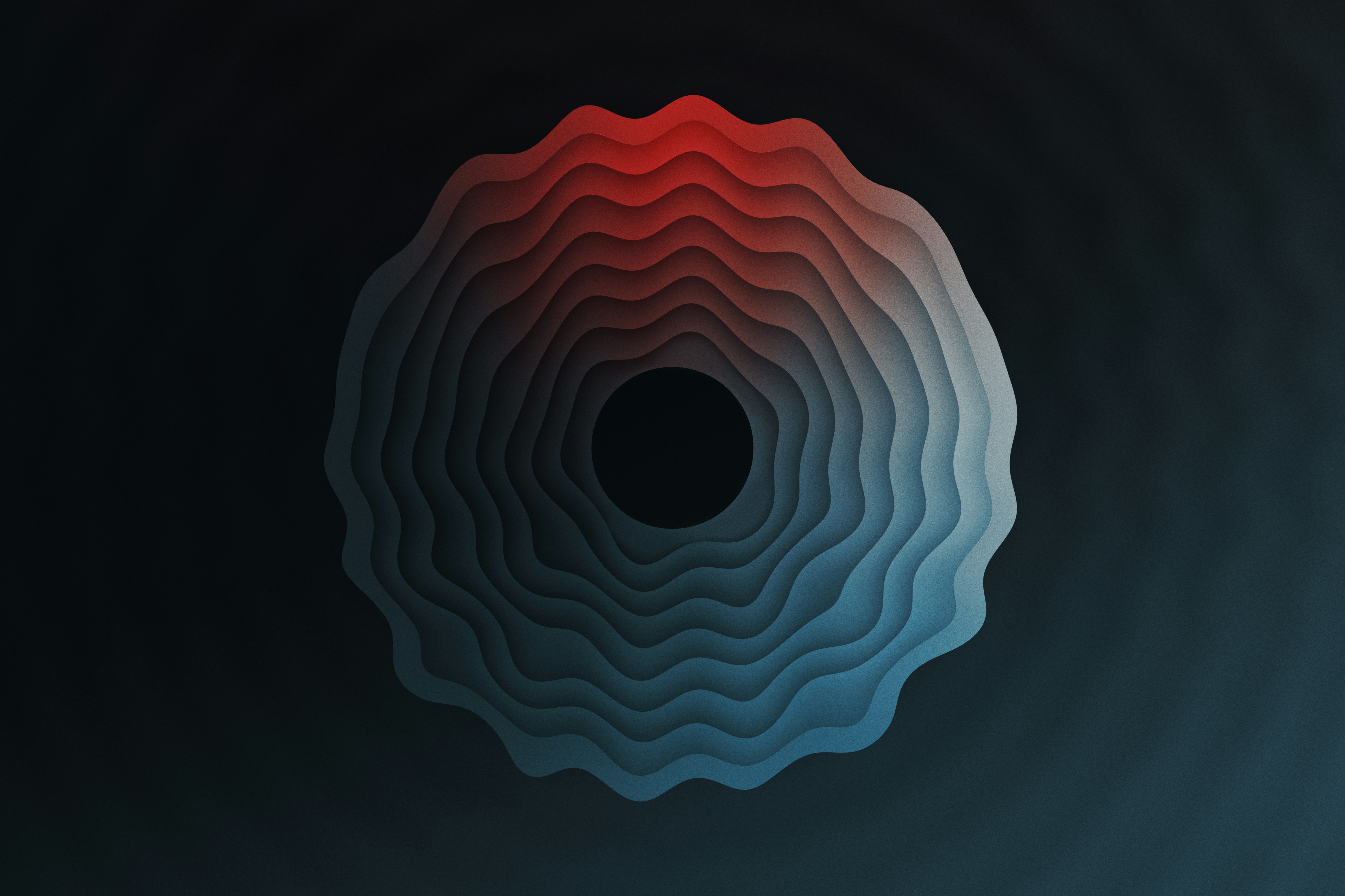 a black background with red and blue shapes