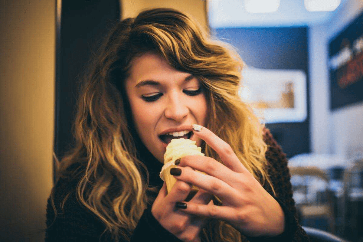 body composition a woman eating muffin